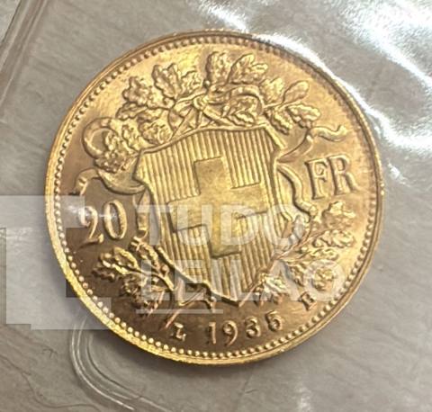 Colecionável. Moeda em ouro suíço de 20 francos, datado de 1935. Reverso: Apresenta o escudo com a cruz suíça e ramo de carvalho. Anverso: A...